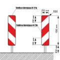 Schemat techniczny tablic kierujących U-21a i U-21b. Ilustruje ich wymiary, w tym szerokość 250 mm, wysokość 1000 mm oraz promień zaokrąglenia. Rysunek pomocny przy specyfikacji technicznej tablic drogowych.